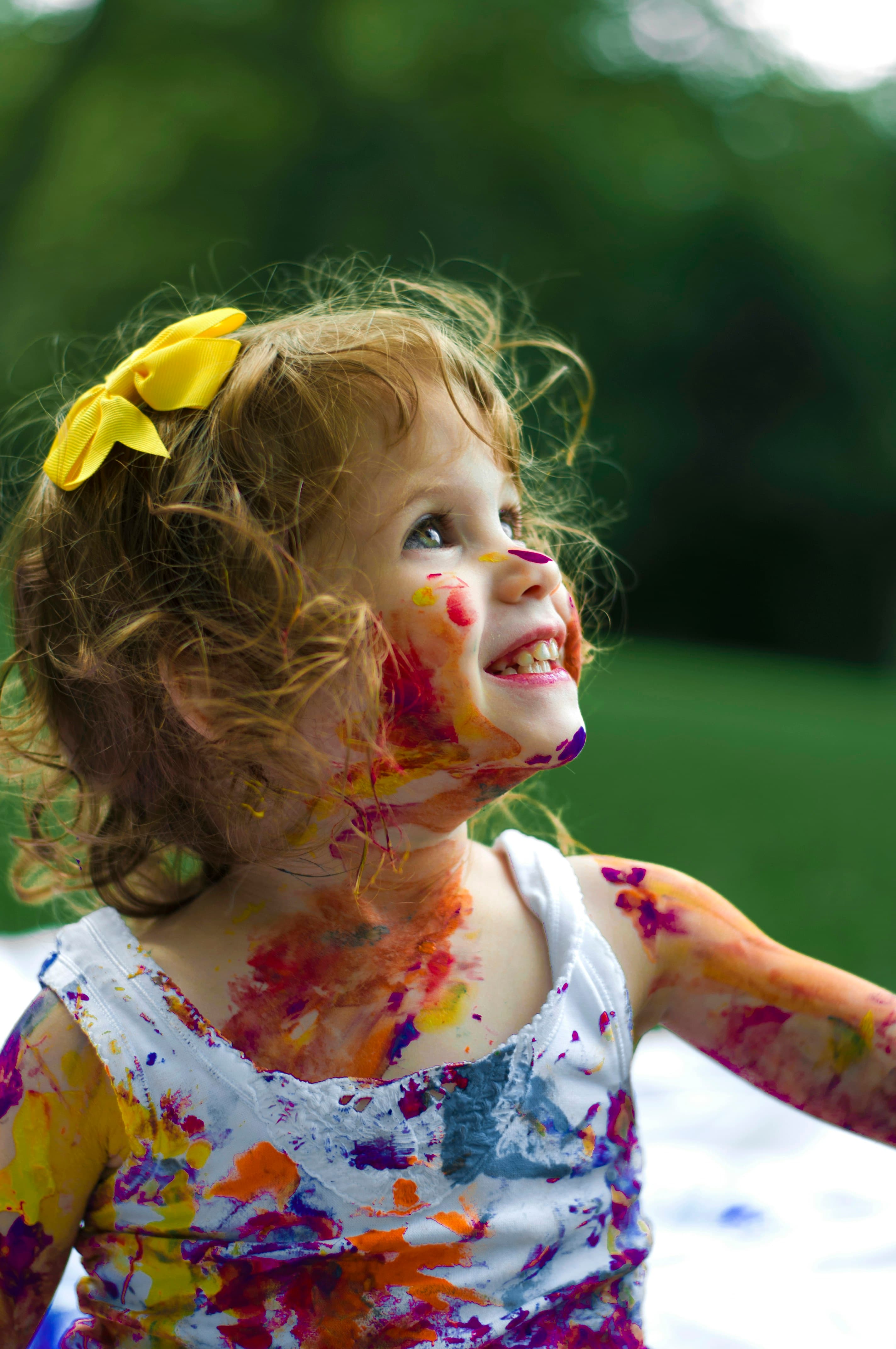 Happy children playing and laughing together in a sunny park